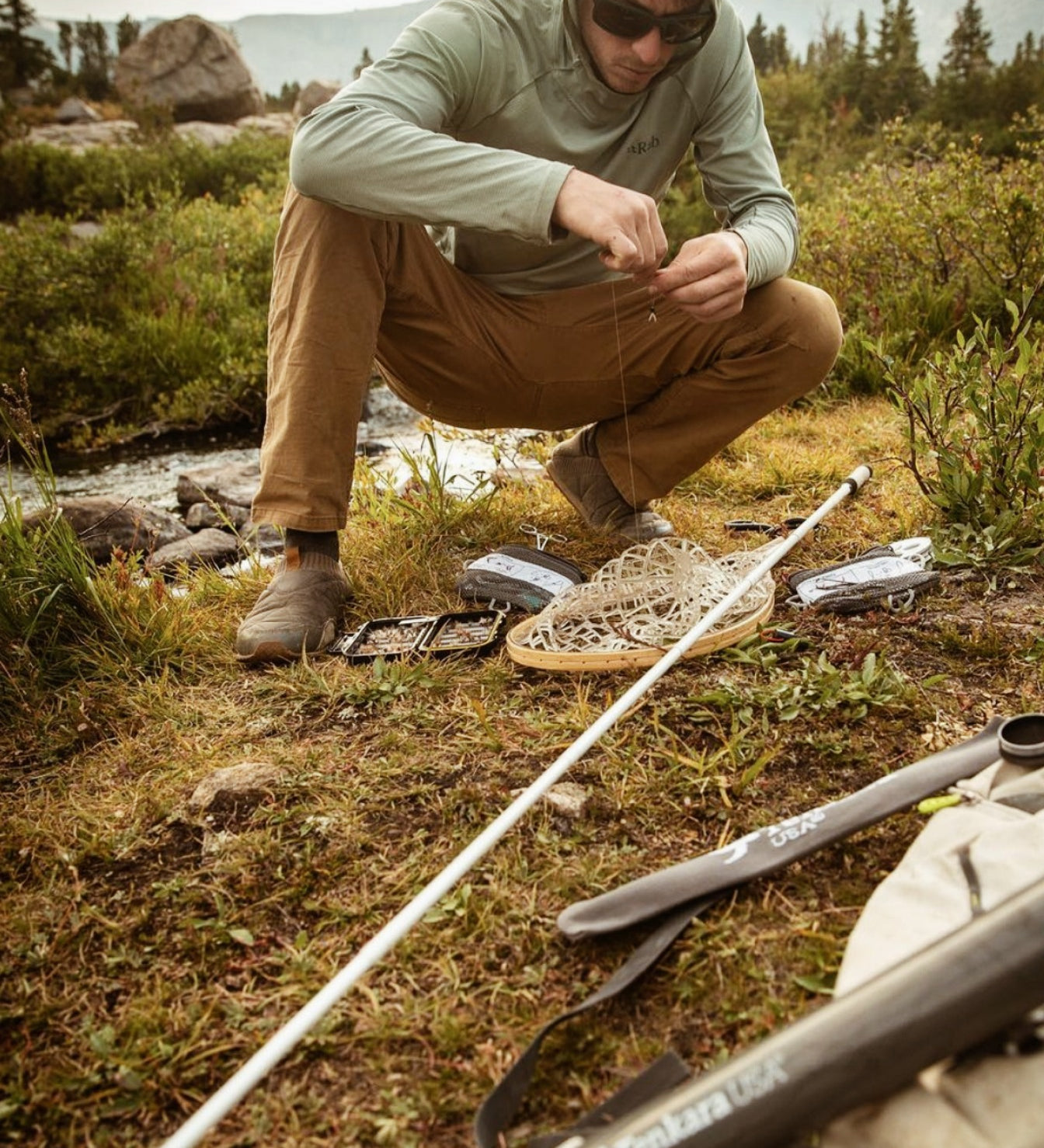 A man manipulating Tenkara Usa accessories.