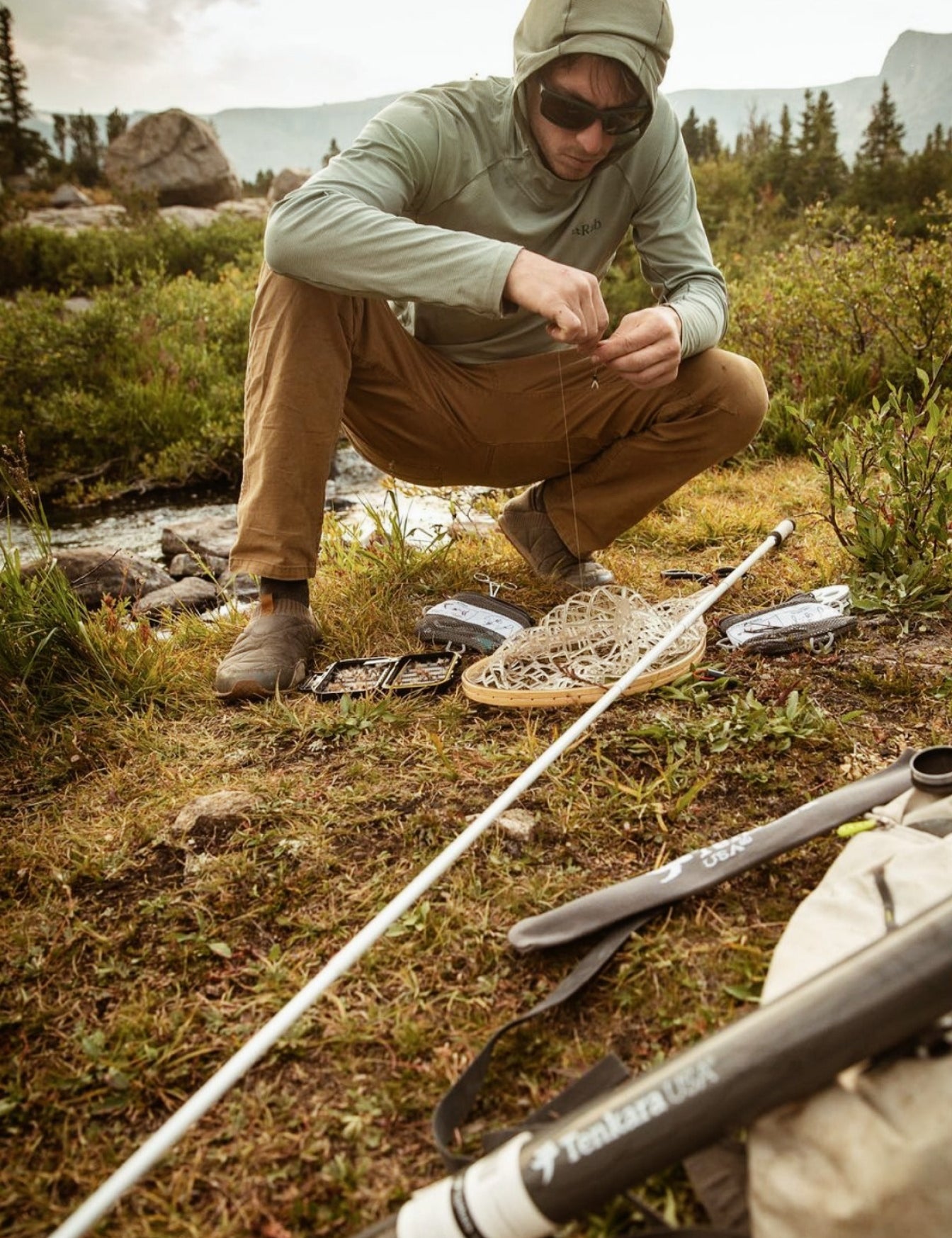 A man manipulating Tenkara Usa accessories.