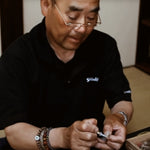Learn how to tie tenkara fly-fishing flies without using a vise with Mr. Amano